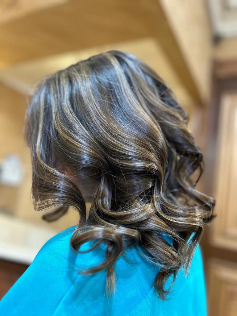 Caramel highlights on dark curly hair